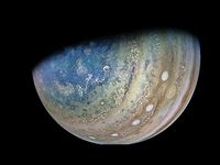 The probe flew closer to Jupiter's largest moon, Ganymede, than any other spacecraft in more than two decades, offering dramatic glimpses of both the icy orb and the gas giant.