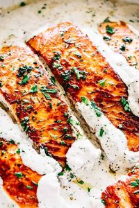 Pan Seared Salmon with Lemon Garlic Cream Sauce - Quick, delicious, bright and creamy salmon dinner prepared in just one skillet and served with an incredible lemon garlic cream sauce! All you need is about 20 minutes and a handful of ingredients.