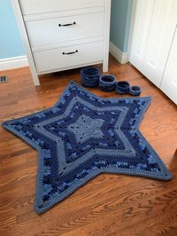 "Crochet Pattern to make a star-shaped blanket (which can also be used as a floor mat) and accompanying nesting baskets. This is a perfect blanket for young children to snuggle with while reading, napping, or watching a favourite show. It can also be used as a bedroom accent, draped over a bed, or placed on the floor to be used as a mat. It is super soft to step onto when getting out of bed and to sit on while playing with items that are stored in the accompanying nesting baskets.  I used Bernat