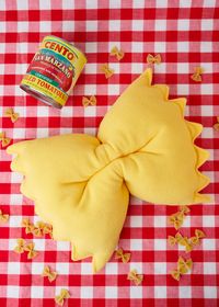 Are you kidding me with this Farfalle Pasta Pillow? If you've ever wanted to take a nap on a sweet cushion of pasta... now you can. 15"by 11" Handmade in NJ Soft fleece