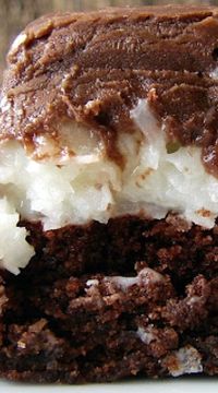 Mounds Brownies ~ These Mounds Brownies taste just like the candy bar. Start with a boxed brownie mix and end with a can of frosting, but the middle is totally homemade.