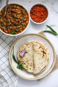 A staple in Indian cuisine, Jowar Roti is a gluten-free flatbread made from finely ground sorghum flour. Light and healthy Sorghum Rotis pair well with curries and dals. Here is my step-by-step recipe with a video showing how to make perfect Jowar Roti at home.