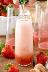 Strawberry Bellinis are a perfect champagne cocktail for parties or brunch. Gorgeous pink color, bright strawberry flavor, they're a delightful twist on the traditional cocktail.