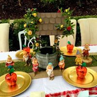 Loving this centerpiece at this Snow White's Woodland Picnic party! The dwarfs are so adorable! See more party ideas at CatchMyParty.com