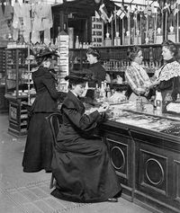 Women shopping for perfumes and jewelry at Illum department store in Copenhagen, Denmark. 1904.