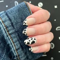 Madison Wilson on Instagram: "It’s been a while since I posted any nail content! I don’t usually do just static nail pics but I am just loving this cow print manicure 🐄 All Holo Taco • Smoothing base • Not Milky White (ironically) 🥛 🐮 • One Coat Black • Matte top coat #holotaco #holotacocombo #cownails #cowprint #cowprintnails #blackandwhite #blackandwhitenails #trendynails #trendy #mattenails #mattenailspolish #mattemanicure #simplynotlogical #paintwithsimply #monochromatic #monochromaticnai