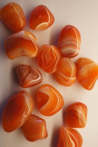 This listing is for one of small carnelian tumbles. The average 8 grams in weight. Carnelian is red agate. These carnelian are a rich warm orange, with banding. They are tumbled and polished nicely. One with banding will be hand selected for you. Most of these look like plain carnelian on one side, and banded on the other. Origin: Brazil Mohs Hardness Scale: 7 Some of us are just beginning our relationship with rocks and crystals. Choosing a rock or crystal is Intuitive... be Intuitive...and hav