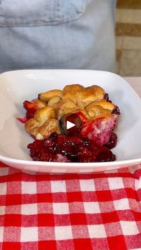 How did I not know about this Grilled Berry Cobbler | cobbler | How did I not know about this Grilled Berry Cobbler | By Robyn Q | Alright, I have two packages of
biscuits. I'm just kind of cutting them into some littler
pieces. I've had a lot of people asking for some grilling
recipes. We're going to make a fun grilling dessert. So, I'm
just going to kind of roll over these. Super easy. Just cutting
them into smaller pieces and you can use a knife too but
this is just a little bit easier way just to kind of get
them all cut up. I think they're all looking pretty.
Yeah, it's been Got it? Yeah. Just little pieces. Nice. So
I'm going to take these little pieces. I'm going to add them
to my bowl. So that was two packages of biscuits that I
used for this. I have a half a cup of flours. I'm goi