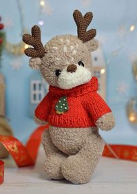 Create your own adorable festive holiday decor with this detailed Reindeer Crochet Pattern! Perfect for adding a touch of handcrafted charm to your Christmas celebrations, this amigurumi project makes a delightful addition to your holiday decorations or a thoughtful handmade gift. ✨ What's Included: This pattern guides you step-by-step to create a charming reindeer complete with a cozy sweater, adorable details, and festive flair. You'll need: 1. DK Light Worsted Fluffy Yarn:      - Alize Softy (50g/115m) in shades:        - №617 (main body - one skein is sufficient)        - №55 (muzzle) 2. Sport Weight/4-Ply Yarn:      - Gazzal Baby Cotton №3443 (sweater) 3. Lace Weight/1-Ply Yarn:      - Iris in green and brown (accents) 4. 10mm Safety Eyes for expressive reindeer eyes.   5. Hook Sizes: