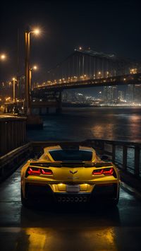 Experience the exhilaration of the Chevrolet Corvette Z06 as it cruises through a cityscape framed by shimmering lights and a coastal bridge at night. Get this stunning mobile wallpaper and embrace the night. #ChevroletCorvette #NightDrive #CityLights #MobileWallpaper #MobileBackground #PhoneWallpaper #PhoneBackground #CarWallpaper