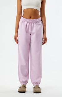 Reach post-workout comfort with the PacSun Classic Sweatpants. These high-waisted sweatpants have a drawstring waistband for a customizable fit, side hand pockets, and elastic ankle cuffs.    	12.625" rise 	29.25" inseam 	Solid color sweatpants 	High-rise 	Drawstring waistband 	Elastic ankle cuffs 	Side hand pockets 	Relaxed fit 	48% modal, 46% polyester, 6% spandex 	Machine washable 	Model is wearing a size small 	Model measurements: 5’5” height, 32” bust, 22&rd