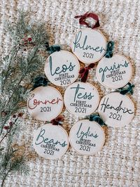 "Personalize your tree with these machine embroidered ornaments. Each ornament is made with canvas fabric attached to a 4\" embroidery hoop. The back of the ornament is covered with felt to protect the stitching. Your choice of personalization, thread color, and ribbon."