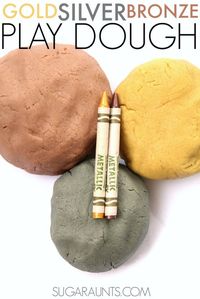 Gold, silver, and bronze play dough with sparkles! Made from metallic crayons.