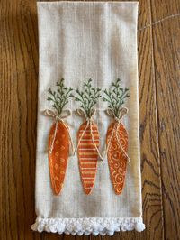 Linen Carrots Hand Towel with Three Adorable Patterns These adorable patterned carrots in polka dot on the first carrot, horizontal stripe on the second, and scroll pattern on the third. Each carrot has a jute bow separating the carrot and green leaves. Perfect to decorate for Spring and Easter!