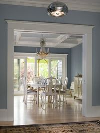 Traditional Dining Room - Whether or not you like the traditional Wedgwood design, it has inspired generations of color schemes with while moldings — in particular, white on Wedgewood blue. You can see this classic scheme here in a beautiful room with Georgian-style light and proportion. Note also the wooden floor and Oriental rug, also typical of the era. #tallahasseedining #diningrooms