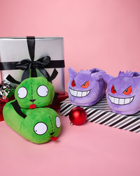 Cozy up with your favorite Pokémon character with these fun purple plush Gengar slippers! These slippers with dotted grippers on the bottom will always keep your feet warm and make you smile.