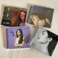 my olivia cds collection😇  signed sour cd, guts signed cd, drivers license single cd, vampire cd