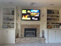 fireplace with bookshelves on each side | Fireplace with shelving unites on each side