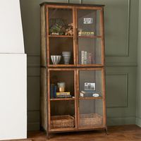 Taken with ideas from traditional homes and a mix of modern ideas, our Tapered Tower Display Cabinet is a grand gesture that will fill your living room or dining room with a smart piece of decor.  Able to peer into each of the four shelves, with glass panes on the front and mesh wiring on the sides, open the split doors to organize your books or throws.