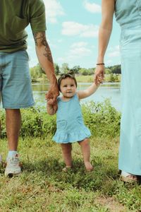 💖 Celebrate family joy with this adorable portrait taken at Sam Peden Community Park! This charming moment features mom and dad holding their baby’s hands on either side, with their little one smiling brightly in the middle. It’s a heartwarming reminder of the love and happiness that family brings.  ✨ Want to see more precious moments from this family session? Visit my website for additional beautiful portraits that showcase the magic of family togetherness! 📸🌼  #FamilyPhotography #SmilingBaby #SamPedenPark