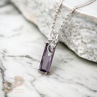 This is my my new beautiful long rectangular amethyst necklace. This 40 Carat lab made sophisticated Amethyst piece features a stunning amethyst gemstone in a sleek, rectangular cut, its deep purple hues catching the light beautifully. Three sparkling cubic zirconia's adorn the pendant bail, adding a touch of brilliance. Amethyst is also revered for centuries for its beauty, is believed to promote calmness, intuition, and creativity. It's also the birthstone for February! This Necklace is crafte