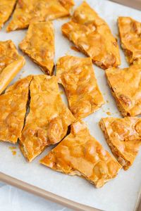 This Microwave Peanut Brittle is super easy to make with only 6 ingredients! It will be a family favorite treat for sure!