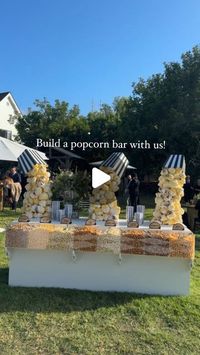 Revelry Event Designers on Instagram: "Ready for a pop of fun? 🍿

This custom popcorn bar was a crowd favorite at this ranch wedding! Our carpentry team crafted unique popcorn sculptures which we hand-painted for a playful look. With eight different flavors to choose from, it was a tasty, creative twist that guests couldn’t get enough of! 

The Team |
Planning & Design: @eventlab1
Event Design & Custom Bar: @revelryeventdesign @revelrymilana
Floral Design: @butterfloral @butterflyfloral_yvonne
Lighting & AV: @images_lighting @rayoflighting
Signage: @velvetfoxdesigns
Popcorn: Laguna Popcorn

#revelryeventdesign #custombar #customweddingdecor #popcornbar #eventbar #weddingdecor #weddingdecorideas #luxuryeventdesign #luxuryweddingdesign #customeventdecor #eventrentals #weddingbar #weddingbts