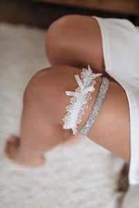 Handmade bridal garters set of two: 1. Bridal garter of crystal beaded embroidery and pearls (ca. 1 cm width) 2. Wedding garter made of delicate lace with a satin bow (ca. 4 cm width) One can buy them separately. Please, check the right choice. Elevate your bridal ensemble with our enchanting crystal bridal garter set, a personalized touch to your wedding attire that exudes elegance and charm. 📏 Size Options: Refer to our size chart below to ensure the perfect fit: Small (S): Circumference abov