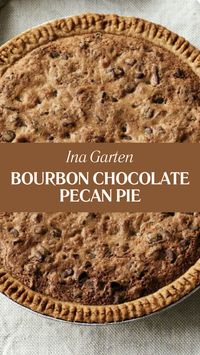 Ina Garten’s Bourbon Chocolate Pecan Pie is made with light brown sugar, granulated sugar, all-purpose flour, kosher salt, unsalted butter, extra-large eggs, pure vanilla extract, good bourbon, semisweet chocolate chips, whole pecans, and a 9-inch store-bought frozen pie crust. This easy pie recipe creates a delicious dessert that takes about 1 hour to prepare and can serve up to 8 people.  This Bourbon Chocolate Pecan Pie Recipe Is From Go-To Dinner Cookbook by Ina Garten.