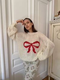 Handmade mohair jumper with a red bow on the front. Cream colour with redbow. Oversized, short fit. Warm and perfect for fall and winter.  made from mohair blend with wool and acrylic (so it wouldn't be too itchy)    Just pre order, it takes around 3-4 weeks to make the jumper, two sizes available 6-12 (XS-L) and 12-16 (L-XXL).  Please message us on instagram or email, if you have any questions: dreamers.rebels.shop@gmail.com   This is a handmade item meaning there was no machine involved in the