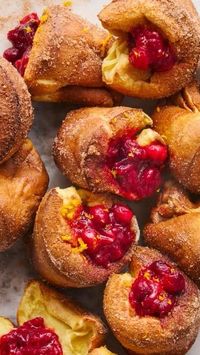 Popovers are simply impossible to resist, and these Orange-Cranberry versions are no exception 😍🍊❤️ Take a buttery #popover, then add #orange zest, a #cinnamon sugar coating, and #cranberry preserves to for the perfect holiday-style donut!! #holidays #easyrecipe #winterrecipe #baking