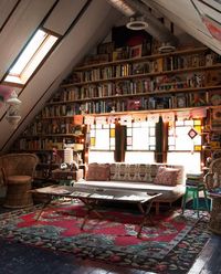 Why fill an attic with boxes and bins when you could convert it into a lofty library, instead? Dream life goals