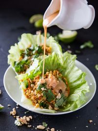 Cauliflower Rice Veggie Lettuce Cups with Sriracha Peanut Sauce // @veggiebeastblog veggieandthebeastfeast.com