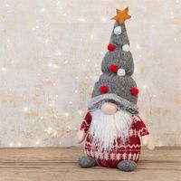 Add some Christmas magic to your home decorations with this festive Gonk with Pom Poms. Dressed for the season complete with Christmas tree hat this gonk is looking for somewhere to cosy up for the winter. Legend has it that gonks can bring good luck to those that take them in and treat them well!