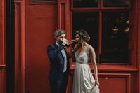 These beer lovers couldn't help but sneak a sip at an Irish pub after saying "I do" to each other | Image by Antonija Nekic Photography  #wedding #weddinginspiration #dublin #dublinwedding #cityhallwedding #weddingportrait #cutecouple #bride #bridalinspiration #groom #groominspiration