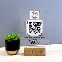 High quality personalised QR code scan for menu in clear acrylic with a standard wooden stand. An efficient way to keep high safety and hygiene standards, but also quick and easy for food and drink ordering. Once scanned, it will send your customers to your online menu in seconds! UV printed to a high quality. I can print your logo, message and QR code at no extra cost Once you've placed the order, please send your logo through etsy chat. Available size: A5 - 148x210mm (5.8 x 8.3 inch) Material: