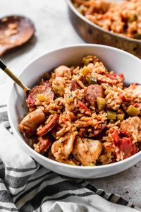 This easy Jambalaya recipe is healthy comfort food made in just one pan! It's loaded with chicken, sausage, veggies, and bold cajun flavors your family will love.