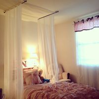 Girls room decor, DYI canopy bed, two upside down curtain rods and large piece of fabric purchased at Joan's