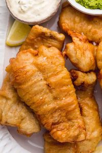 Light and crispy Beer Battered Fish prepared the traditional way! To make the batter ultra-crispy, the water is replaced with beer for better texture and flavor. #beerbatteredfish #friedfish #fishandchips