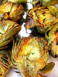 Grilled artichokes with garlic and cheese.