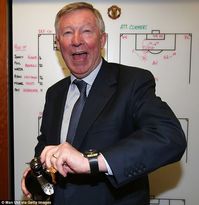 Sir Alex Ferguson pops the cork in front of his tactics board