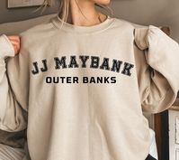 "JJ Maybank Sweatshirt, JJ Maybank OBX Sweatshirt, Outer Banks Sweatshirt, Pogue Life Sweatshirt, Obx North Carolina Sweatshirt Brand: Gildan  Fit: Unisex/Mens Sizing- NOT very oversized, \"True to Size\" if you want and oversized look size up.  -Arms tend to be baggier then the rest of the fit.  Ideal for any situation, a unisex heavy blend crewneck sweatshirt is pure comfort. These garments are made from polyester and cotton. This combination helps designs come out looking fresh and beautiful.