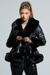 Girly, cozy, warm. The "it" jacket of the season is here to elevate your cold weather wardrobe. The AZALEA WANG Faux Fur Trim Peplum Moto in Black features a luxe leather fabrication, plush tonal faux fur trim, a peplum silhouette, and a waist tie belt. Complete with a smooth inner lining and a robe-like design. Finish off your look with a crisp button down, faux leather leggings, and chunky heel booties.  - Fur: 100% Polyester, Fabric: 67% Polyurethane 20% Polyester 14% Viscose - No Stretch - Imported (all measurements approximate from size small) - 27” Shoulder to Hem - 24” Sleeves - Model is 5'10.5" Product ID: 258831 (all measurements approximate from size 1X) - 29” Shoulder to Hem - 26” Sleeves Product ID: 359194