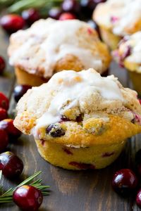 These light and tender cranberry muffins are filled with fresh berries and orange zest, then topped with streusel and a simple orange glaze.