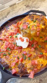 This easy tamale pie is made with taco seasoned ground beef, enchilada sauce and shredded cheese baked on top of a corn bread crust. #tamales #recipe  #dinnerrecipe