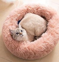 Image via Amazon feat. Round Fluffy Anti-Anxiety Cat Bed in Pink