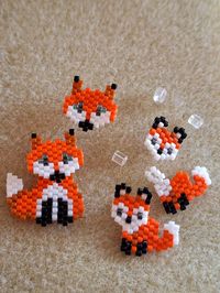 "Hand made crafted in the UK, bead weave little foxes. The designs are either depict a fox head on gold plated studs. The combo set is a combination of fox head stud with a detachable body so there two earrings in one. These themed earrings comes with a set of rubber/silicon backs to keep the earrings nice and secure. see below for details. Made to Order - you can choose which design, and choice of setting - Once you have place your order I will contact you to capture your requirements, then cre