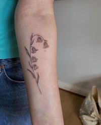 Explore the elegance of nature with a bluebell wild flower tattoo beautifully designed on the forearm. Follow us for more tattoo inspiration and ideas! #ForearmTattoo #NatureElegance #WildFlowerTattoo #TattooInspiration #TattooIdeas Tattoo image credit - @b.inkks Explore more tattoo designs and meanings on our website!