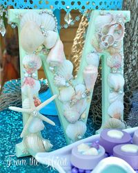 Custom Mermaid letters vintage sea shell sign for DIY under the sea mermaid birthday party. Who doesn't love mermaids?! This is genius! So perfect for kids birthday parties! Under the sea and the little mermaid as a party is awesome! So many DIY ideas that are easy and cheap. Which is even better since we done want to break our budgets throwing a mermaid party. I like the food, dessert, decorating, activity ideas! Love it saving it for later!