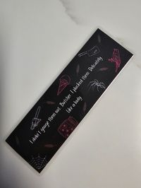 "\"I didn't gouge them out, Butcher. I plucked them. Delicately. Like a lady.\" Butcher & Blackbird bookmark Laminated with the option to add a tassel.  **Please add tassel color preference in personalization box."